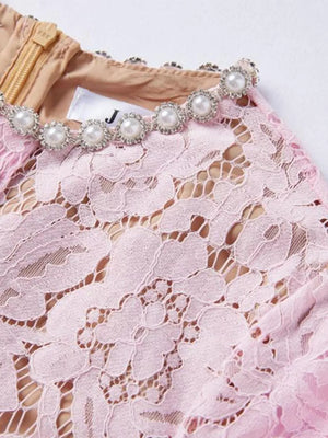 Powder floral lace dress with pearl and crystal embellished neckline.