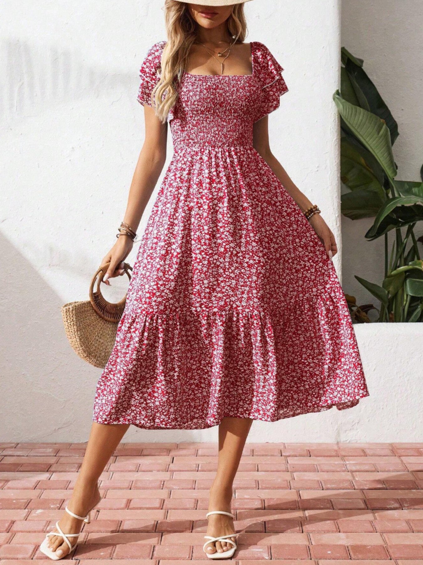 Red floral smocked ruffle sleeve midi dress with tiered skirt.
