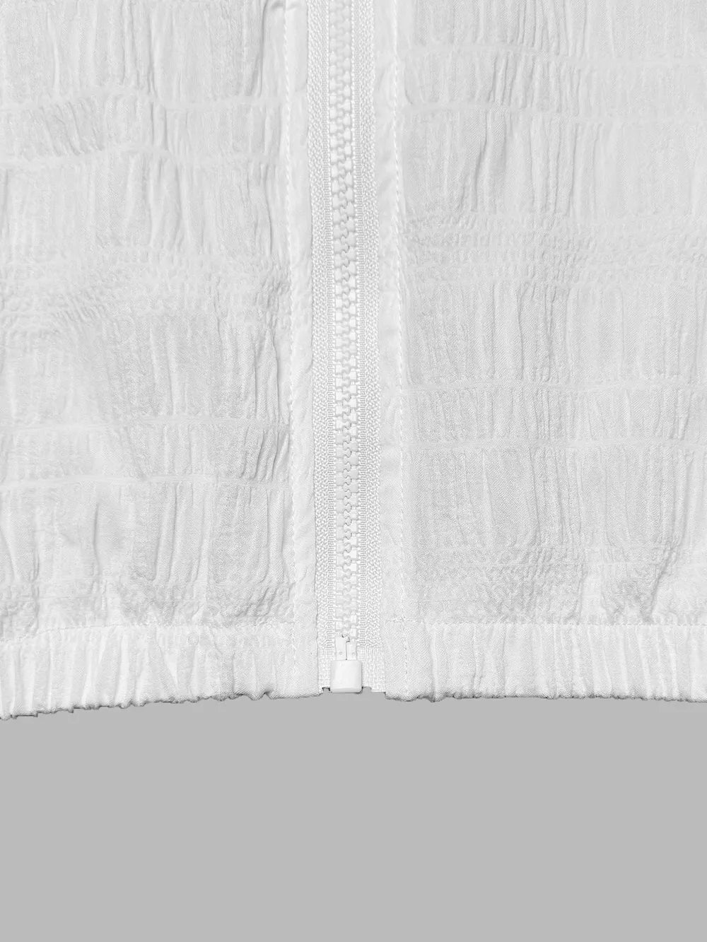 White textured lightweight hooded jacket with a full zipper and elastic hem.