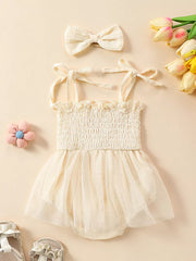 Apricot smocked bodysuit with tulle skirt and matching bow headband.