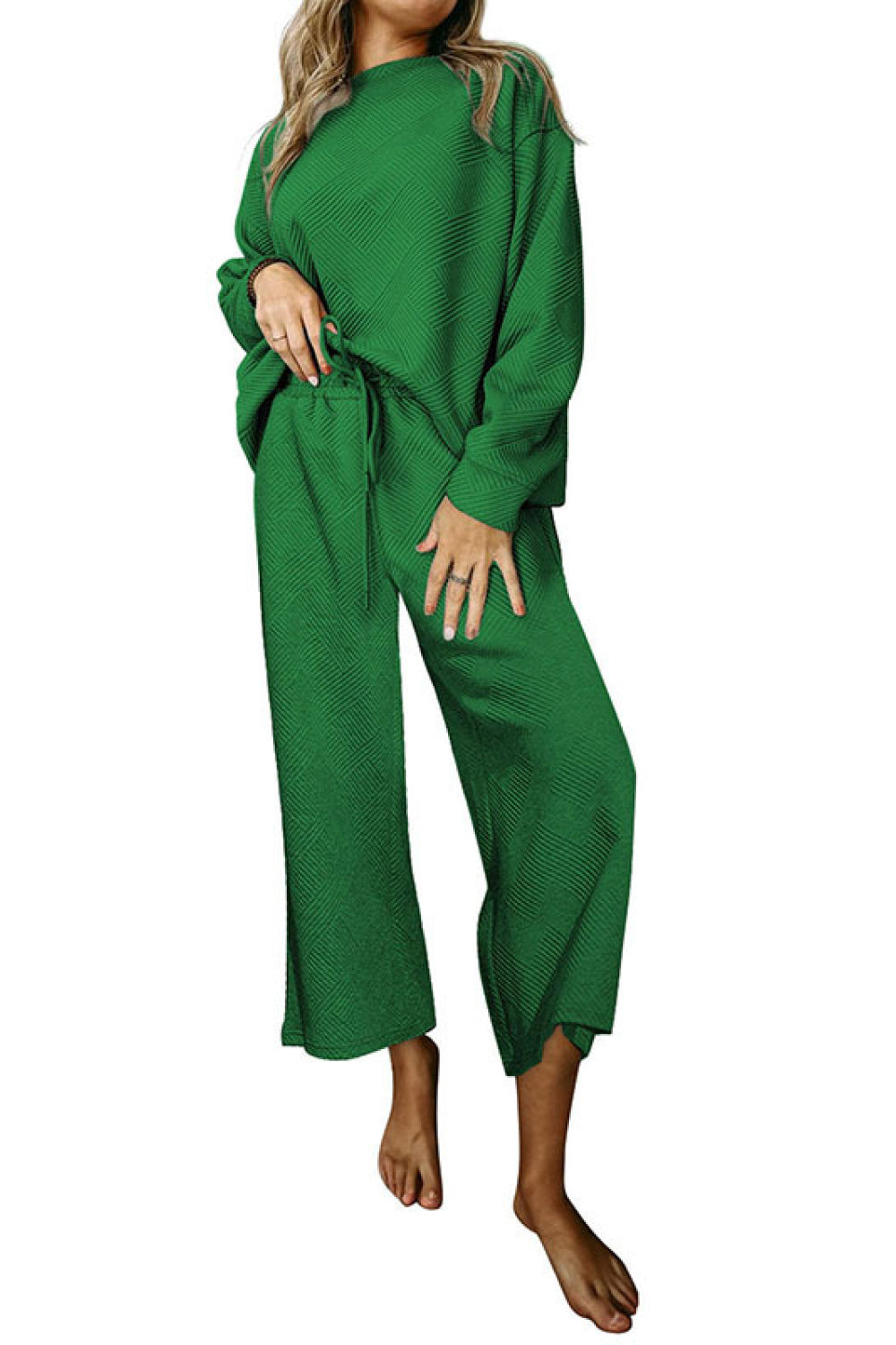 Green loungewear set with drop sleeves and wide-leg pants featuring a textured pattern.