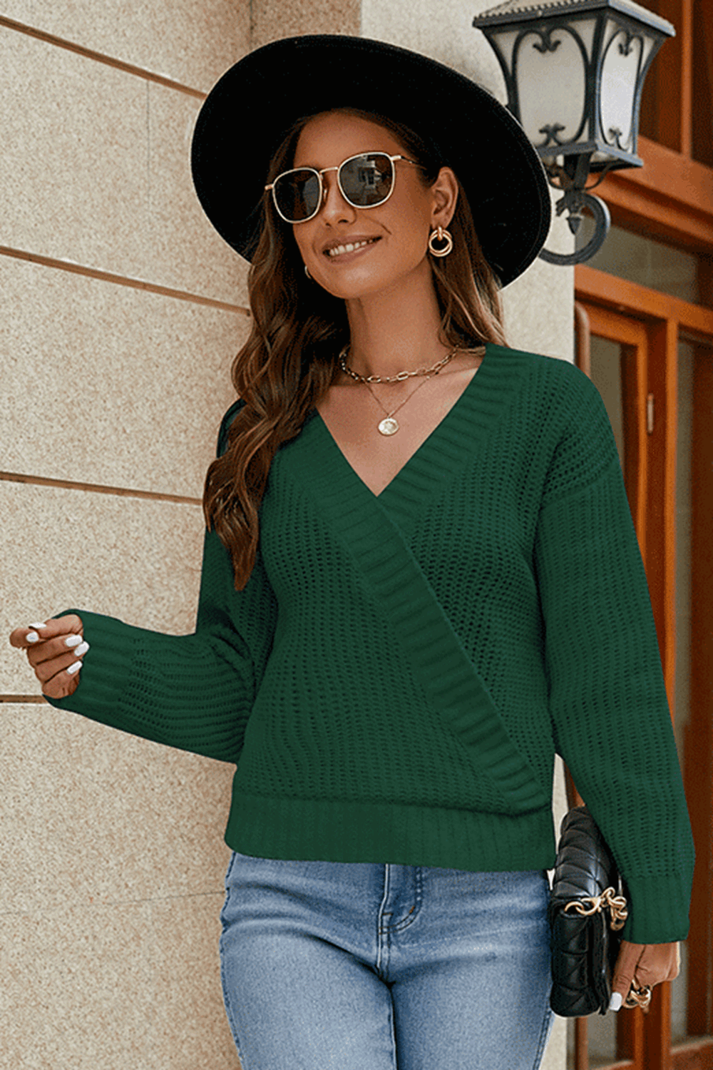 Dark green wrap knit v-neck pullover sweater with a textured knit and relaxed fit.