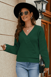 Dark green wrap knit v-neck pullover sweater with a textured knit and relaxed fit.