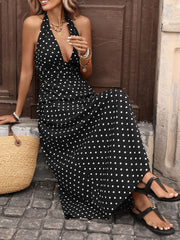 Black polka dot maxi dress with halter neck and deep V-neckline