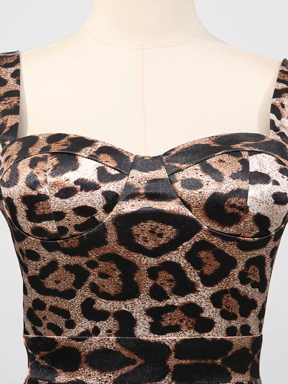 Leopard print bodycon midi dress with sweetheart neckline and wide straps.