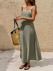 Olive spaghetti strap maxi dress with contrasting white trim and a-line cut.