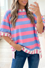 Oversized striped maternity shirt with patchwork details, pink and blue stripes, crew neck, short sleeves.