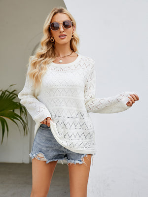 White openwork knit crewneck pullover sweater with diamond pattern detail.