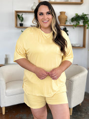 Yellow bamboo loungewear set with relaxed fit tee and shorts, featuring a chest pocket.