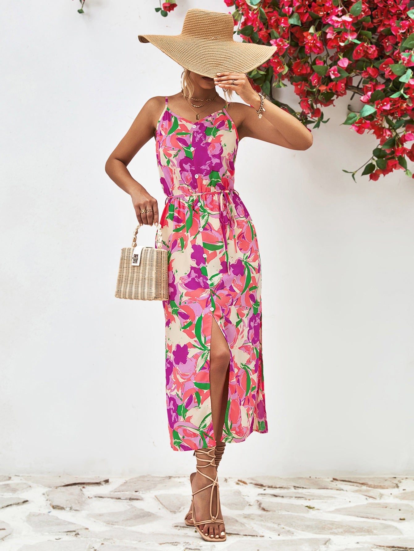 Floral print midi dress with button-down front, spaghetti straps, and a high slit.