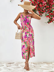 Floral print midi dress with button-down front, spaghetti straps, and a high slit.