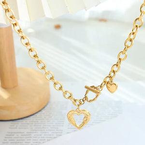 Gold chunky chain necklace with toggle clasp and open heart pendant