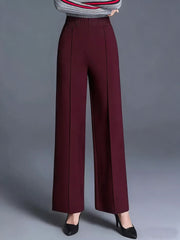 Burgundy high-waisted wide leg cotton trousers with front seams and pockets.