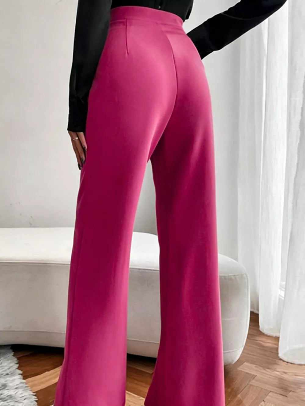 Sleek high-waisted flare maternity pants in cerise, showing the flared leg detail.