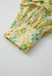 Yellow green floral ruffle yoke button-down blouse with button cuff detail