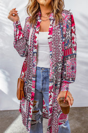 Patchwork print duster shirt jacket with button front and long sleeves, styled with jeans.