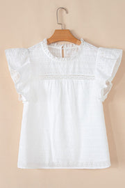 White eyelet yoke blouse with ruffle sleeves and a lace inset detail.