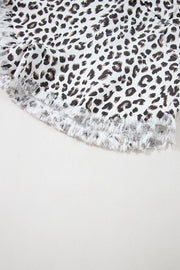 Leopard print denim shorts with frayed hem detail
