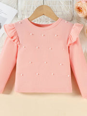 Pink ribbed long sleeve top with pearl embellishments and ruffled shoulders.