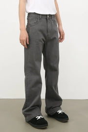 Wide-leg dark gray washed denim trousers with a relaxed fit.