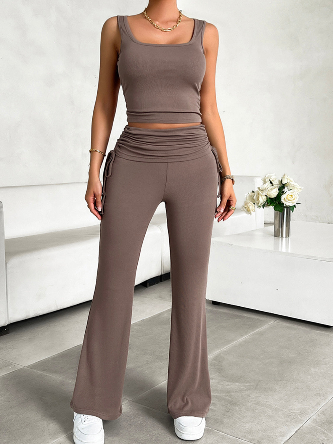Taupe ribbed ruched waist tank top and flare pants set with drawstring details.