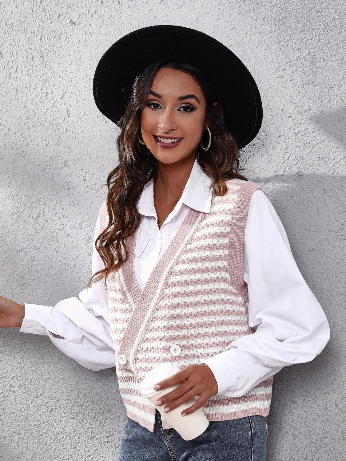 Double-breasted dusty pink and white stripe knit vest with V-neck and button detail.