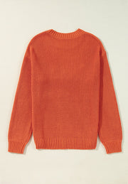 Orange acrylic knit sweater with crew neck and long sleeves.