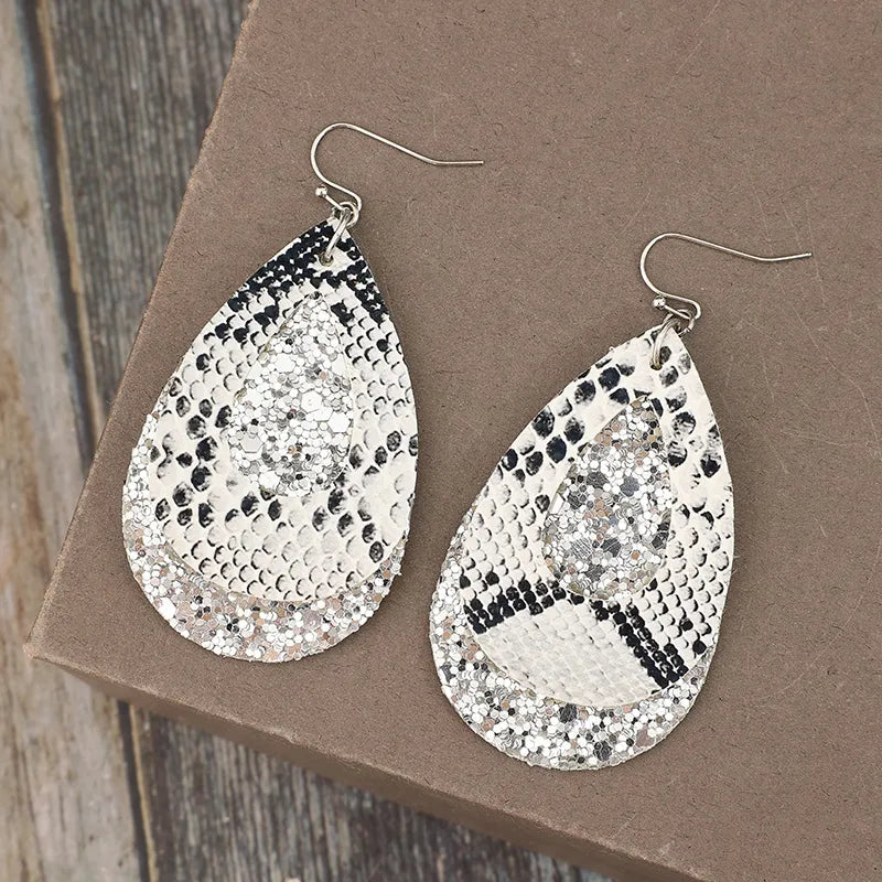 Python print and glitter drop earrings in silver with layered teardrop shape.