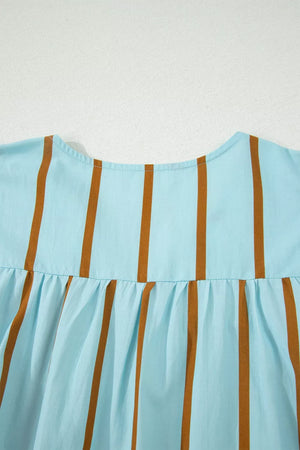 Light blue cotton blend blouse with brown vertical stripes and gathered detail.