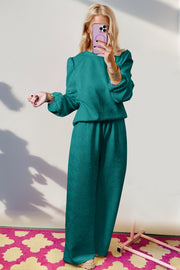 Teal chevron knit lounge set with puff sleeves and wide leg pants.