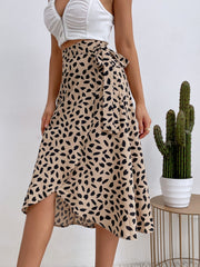 Tan asymmetric wrap skirt with abstract print and tie waist