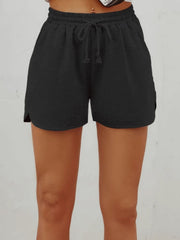 Black textured drawstring lounge shorts with slit hem