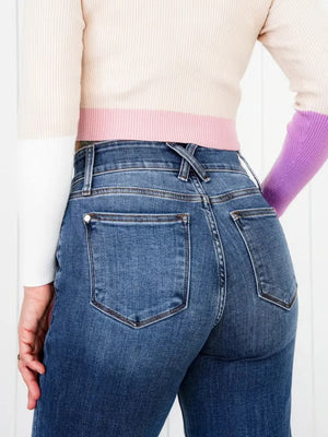 Medium wash denim jeans with utility pockets and wide leg cut.