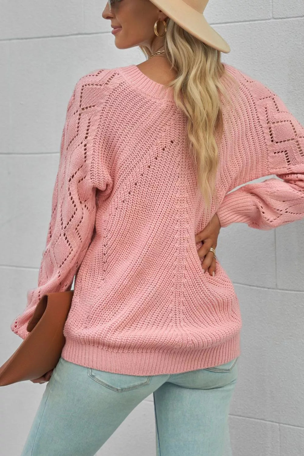 Dusty pink knit sweater with hollow-out diamond pattern on sleeves and body.