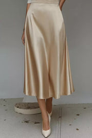 Lustrous midi skirt in khaki with a-line cut and hidden pockets.