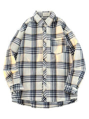 Oversized plaid button-up shirt in cream with navy and tan plaid, long sleeves, and chest pocket.
