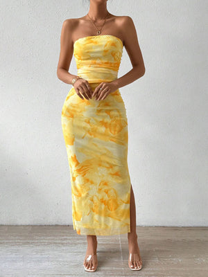 Yellow tie-dye ruched strapless bodycon midi dress with a thigh slit.
