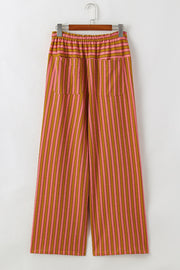 Wide leg pants with pink and brown stripes, drawstring waist, and patch pockets.