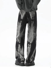 Men's black relaxed fit jeans with acid wash detail and a comfortable fit.