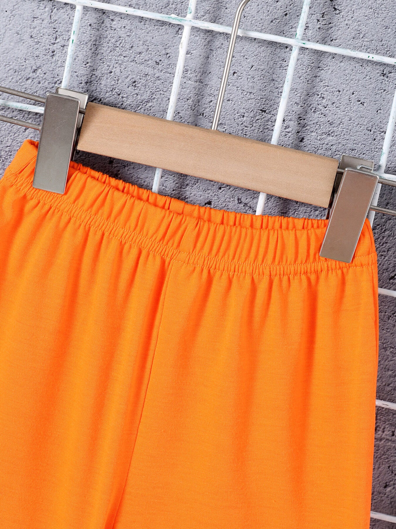 Boys' orange cotton shorts with elastic waistband