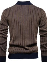 Brown ribbed mock neck sweater with vertical navy stripes and navy cuffs.