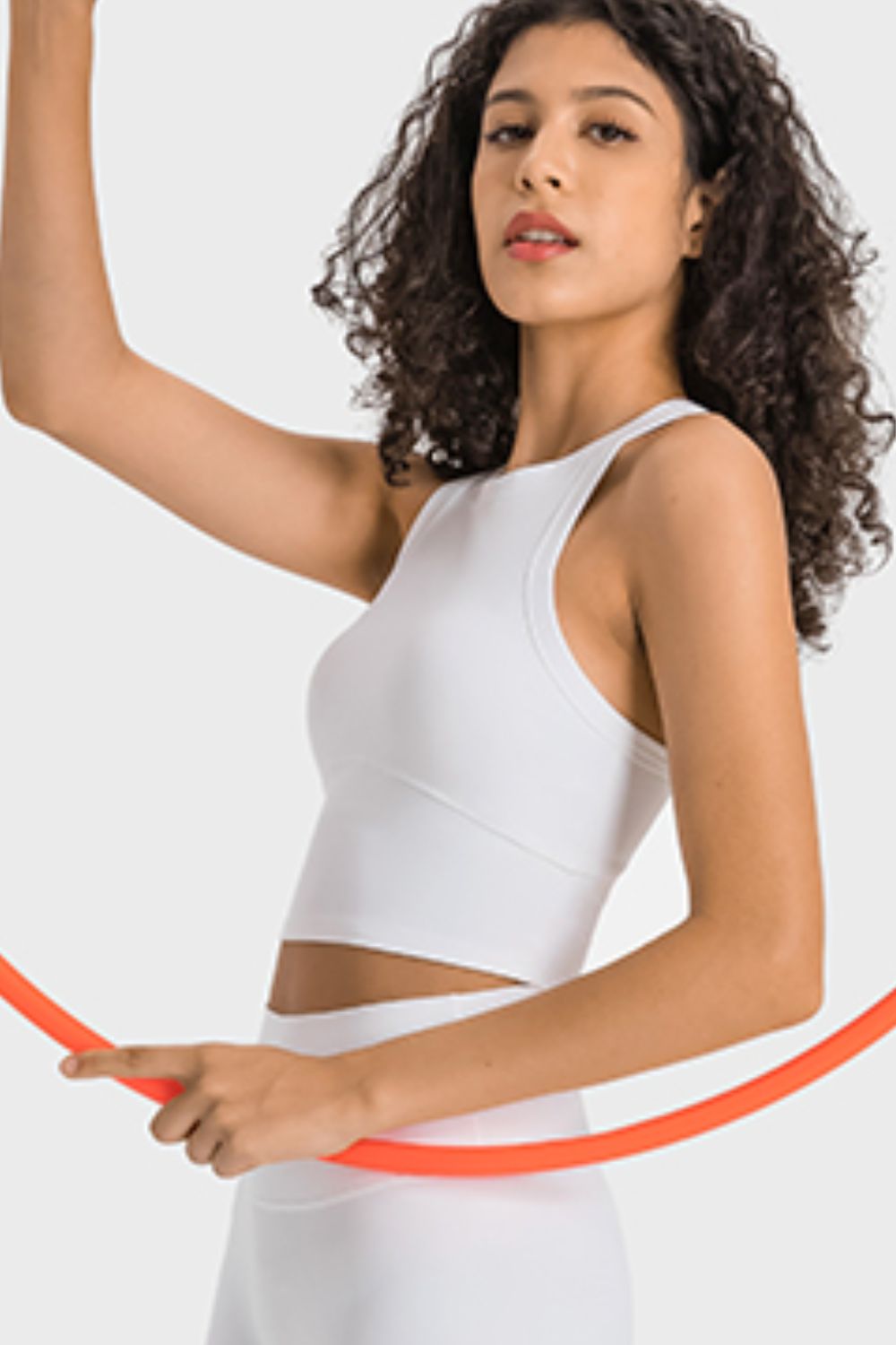 White sculpted neckline crop top with a racerback and contoured seams.