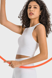 White sculpted neckline crop top with a racerback and contoured seams.