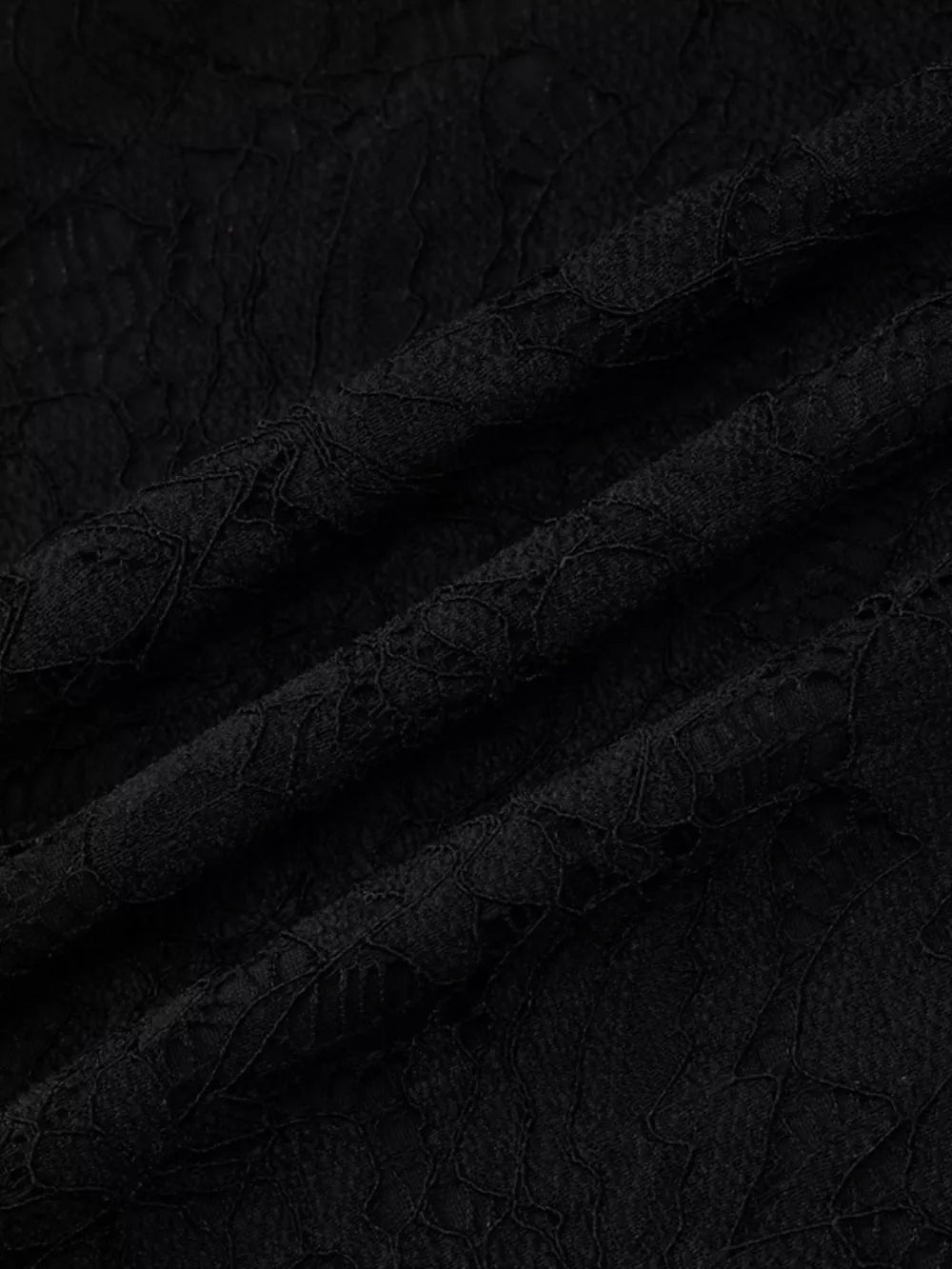 Black lace cutout mini dress fabric detail