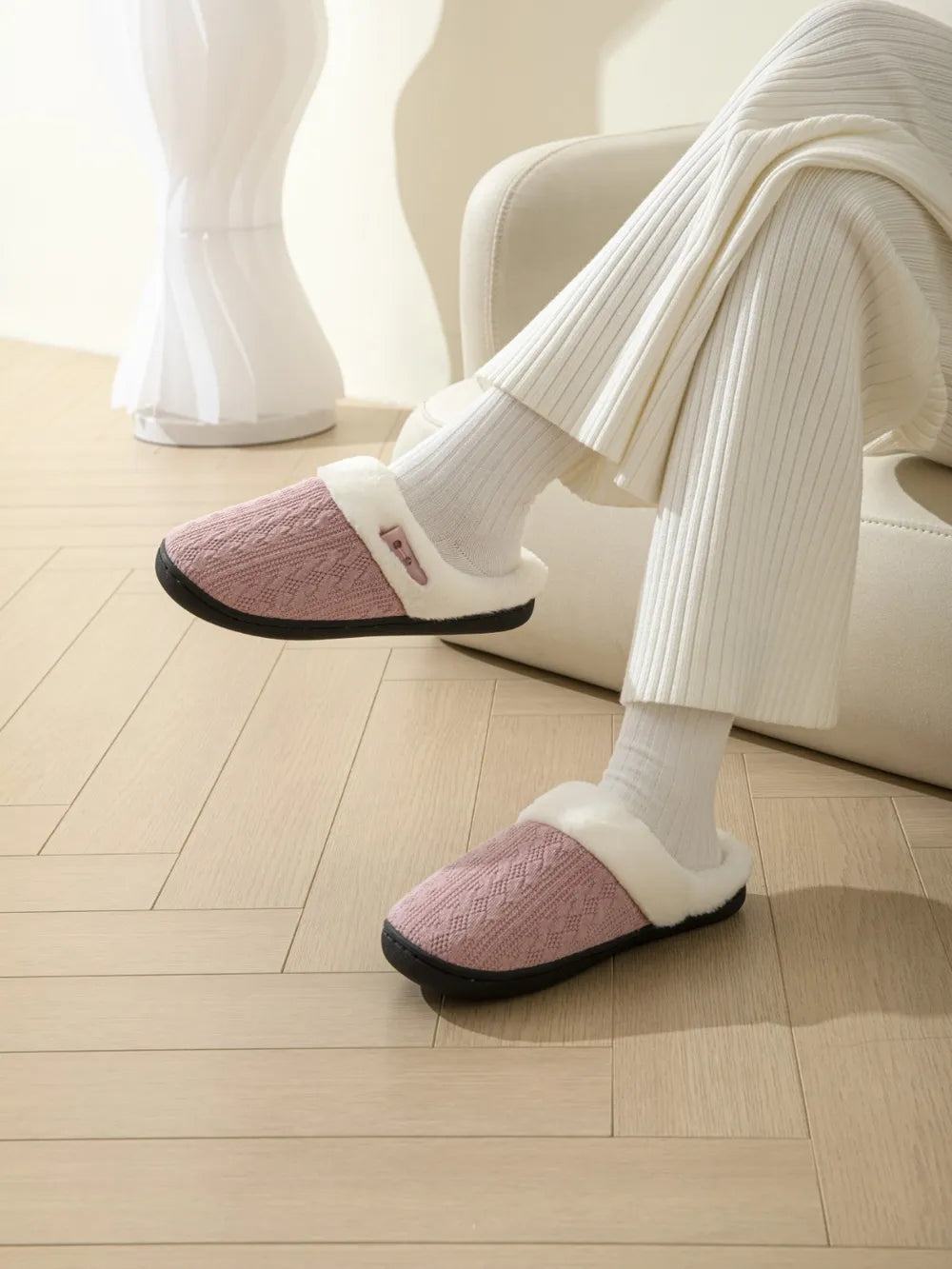 Dusty Pink cable knit shearling house slippers with faux fur trim.
