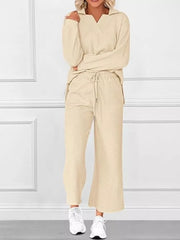 Apricot V-neck textured two-piece lounge set with diagonal pattern pants and long sleeves.