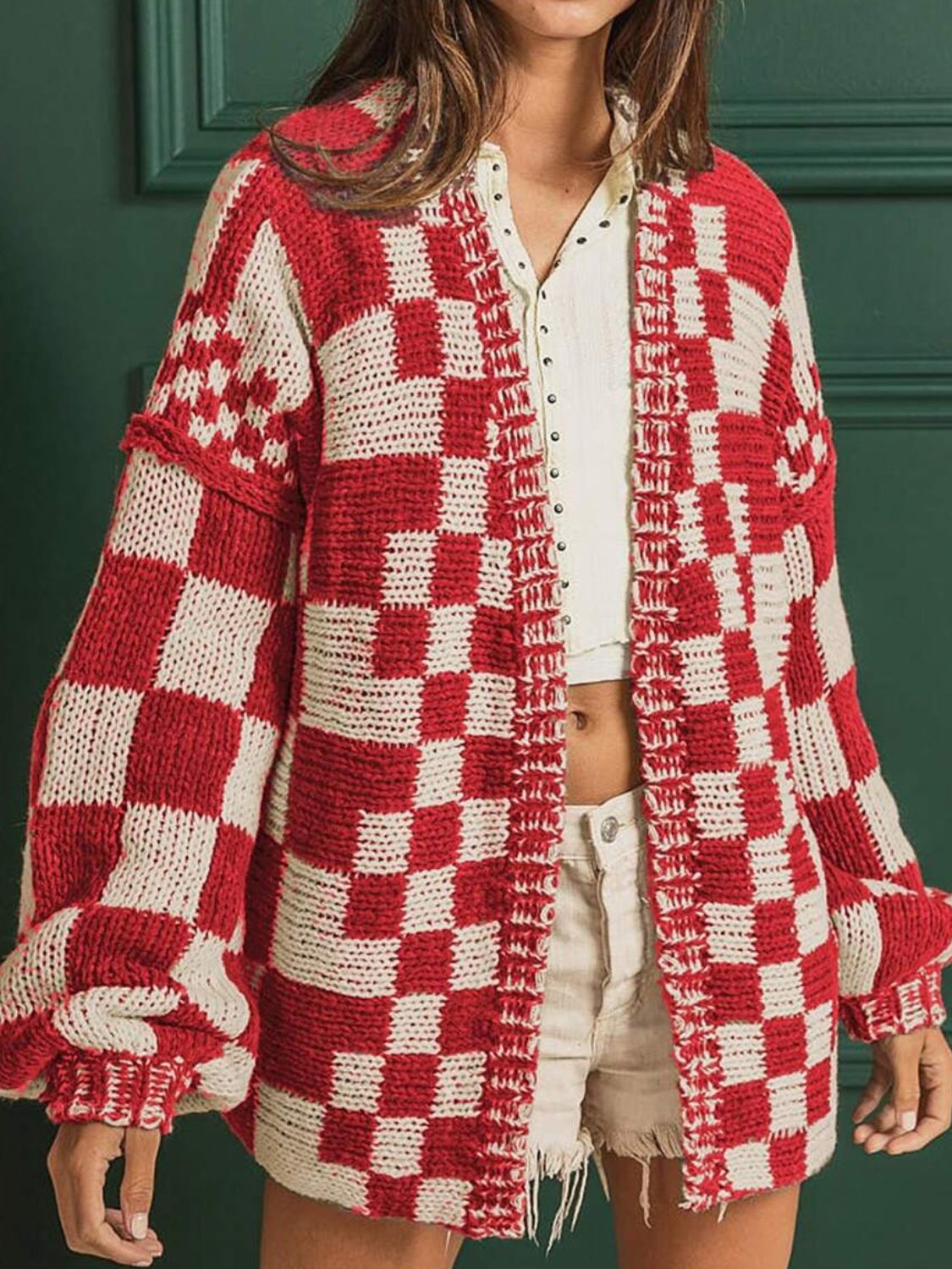Chic checkered acrylic cardigan in deep red and beige with balloon sleeves.