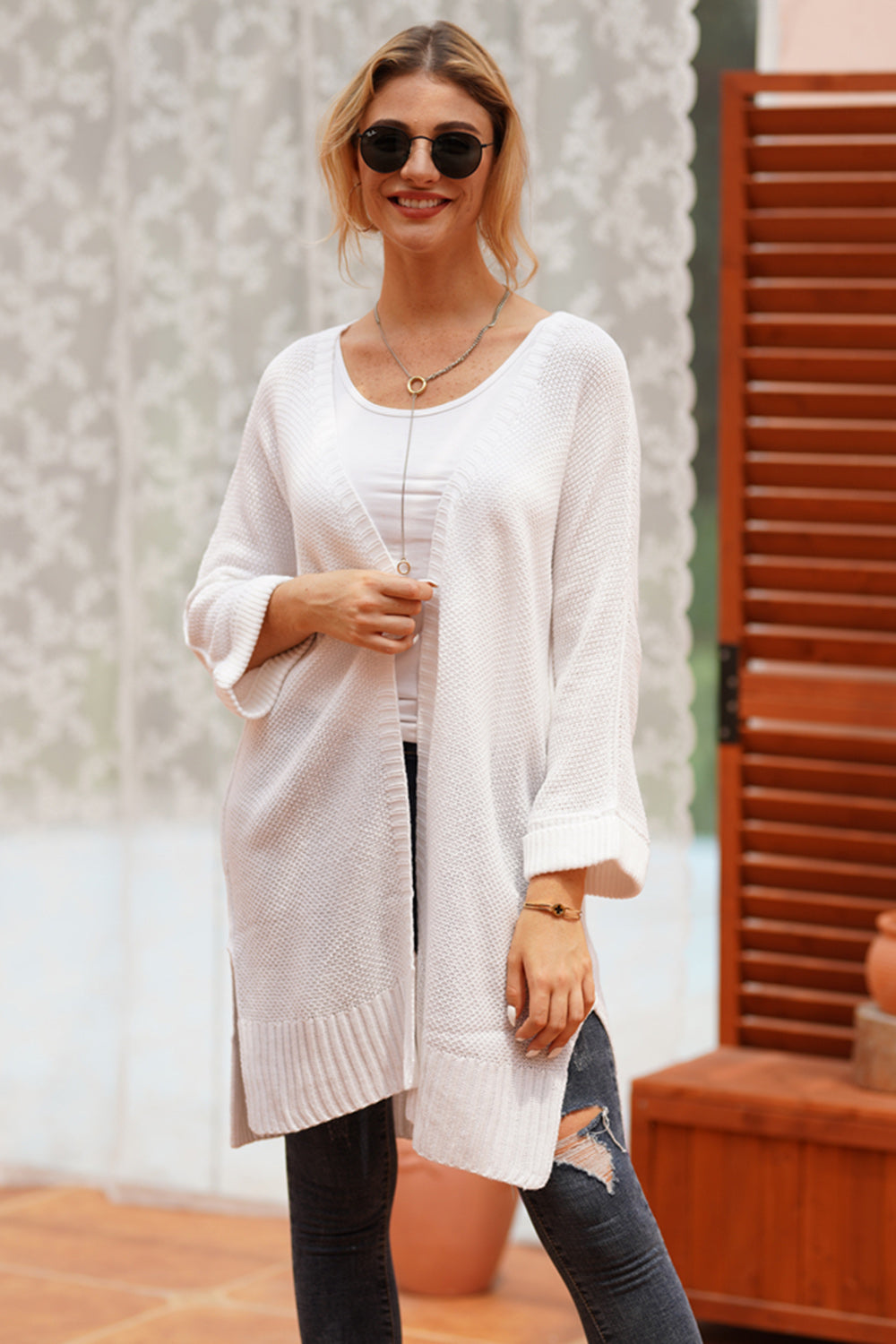 White textured open-front maxi knit cardigan with ribbed hem and cuffs.