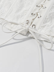 White eyelet tank top with corset lace-up detail and ruffle trim