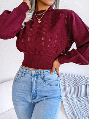 Burgundy openwork knit sweater with puff sleeves and mock neck, cropped length